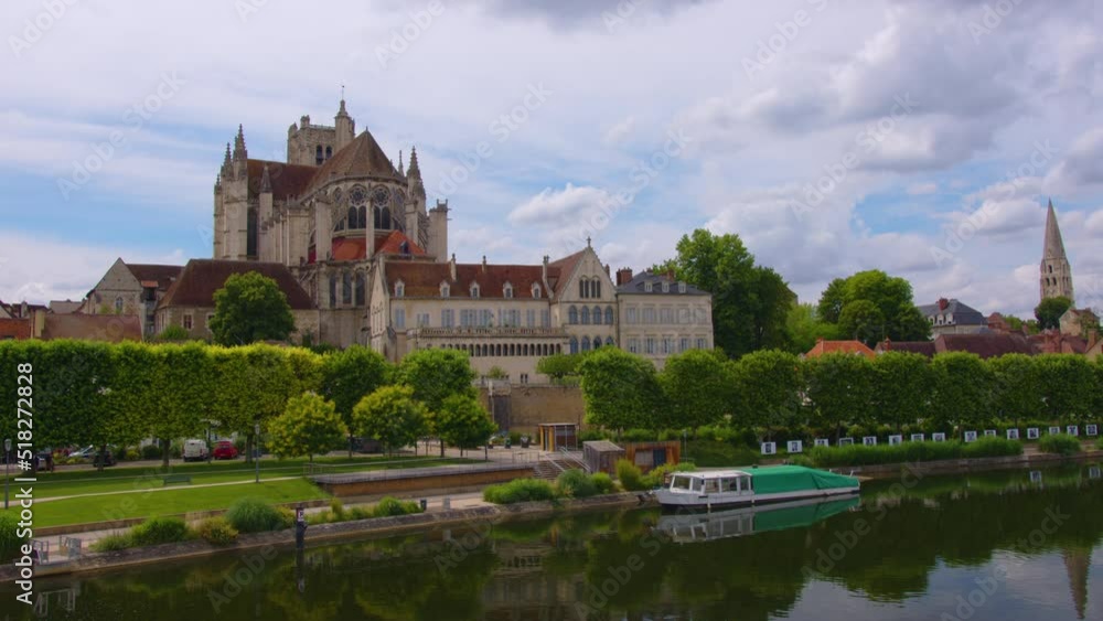 Time lapse. Beautiful clouds in the background of the old city. View of city landscape of Auxerre with Cathedral of Saint-Etienne on River Yonne, Burgundy, France Time lapse. Beautiful clouds in the background of the old city. View of city landscape of Auxerre with Cathedral of Saint-Etienne on River Yonne, Burgundy, France