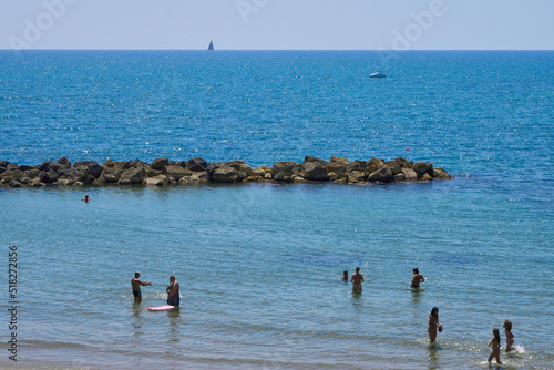 Fototapeta Bathers at Anzio beach, Italy