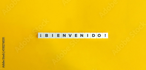 Bienvenido (Welcome) in Spanish Banner. Letter Tiles on Yellow Background. Minimal Aesthetics. photo
