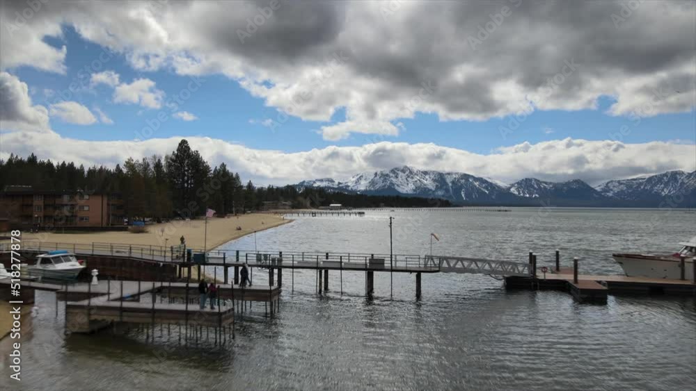 drone reversing flight over Lake Tahoe shoreline at winter season, in the Sierra Nevada of the United States drone reversing flight over Lake Tahoe shoreline at winter season, in the Sierra Nevada of the United States