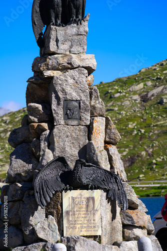 Memorial of crashed and deadly wounded pilot of the Swiss Air Force Adrien Guex at year 1927 with stone pedestal and metal eagle sculptures. Photo taken June 25th, 2022, Gotthard Pass, Switzerland. photo