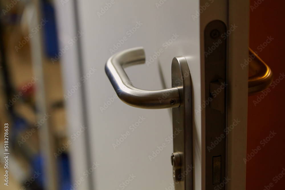 Metal handle on plastic door close up