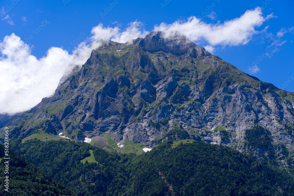 Mountain panorama seen from City of Altdorf, Canton Uri, on a sunny summer day. Photo taken June 25th, 2022, Altdorf, Switzerland.