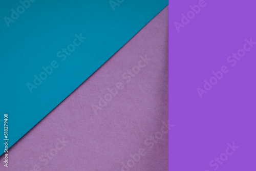 Plain and textured blue pink purple sheet paper arrangement background forming a triangle for creative cover designing