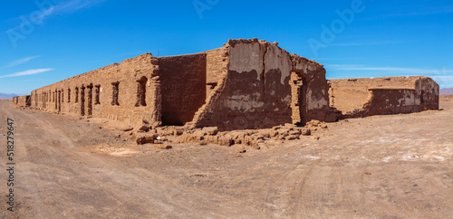 Ruins of abandoned buildings and houses in a mining ghost town from the nitrate era in the Atacama desert in the north of Chile
 photo