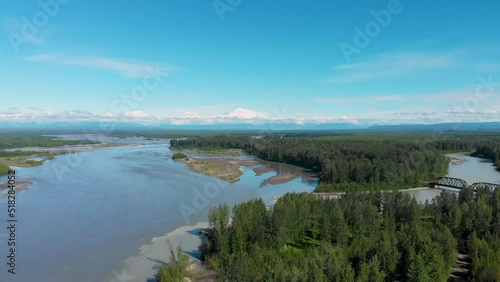 4K Drone Video of Alaska Railroad Train Trestle with Mt. Denali in Distance during Summer photo