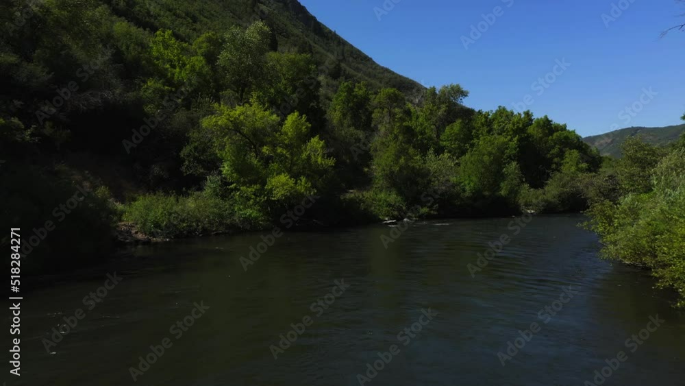 Low altitude aerial shot of the Beautiful Provo River in Utah, USA. A UAV takes us on a short adventure downstream and around corners of the Provo River. Low altitude aerial shot of the Beautiful Provo River in Utah, USA. A UAV takes us on a short adventure downstream and around corners of the Provo River.