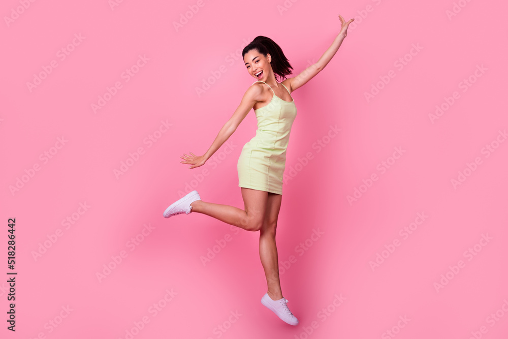 Full body photo of cheerful lovely sweet lady jump high enjoying isolated on pastel color background Full body photo of cheerful lovely sweet lady jump high enjoying isolated on pastel color background