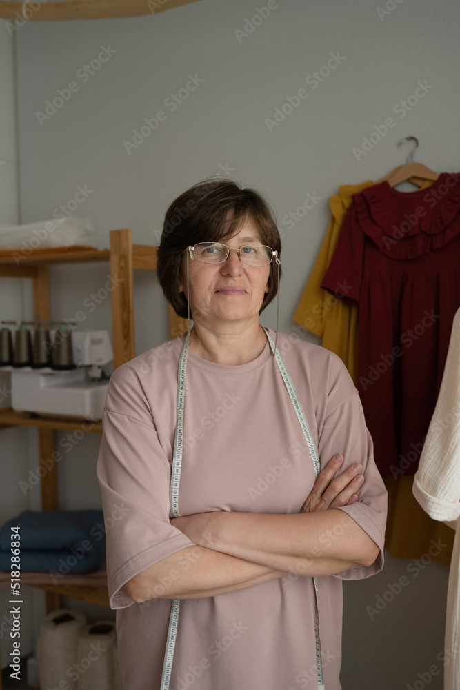 Confident female tailor in studio Confident female tailor in studio