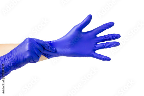 The process of putting on a latex glove. Doctor's hands put on washing gloves. Isolate on a white background.