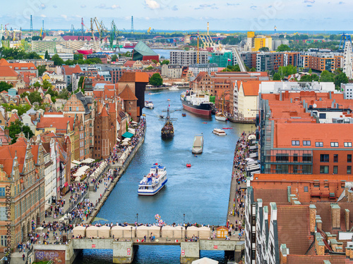 Tourist destination of Gdansk, old buildings in downtown by Motlawa river, aerial landscape