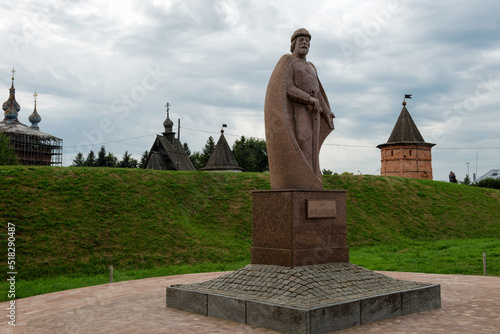 Yuryev-Polsky, Russia - August 10, 2021: Monument to the founder of the city Yuri Dolgoruky. Yuryevsky Kremlin (Archangel-Mikhailovsky Yuryevsky monastery). Yuryev-Polsky town, Vladimir region, Russia photo