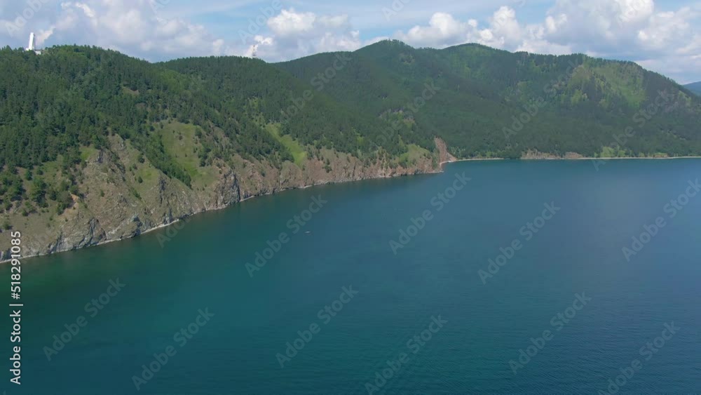 Flight over the rocky shore of lake. Wildlife. Green Forest. Drone video 4k footage. Landscape. Coastline. Flight over the rocky shore of lake. Wildlife. Green Forest. Drone video 4k footage. Landscape. Coastline.