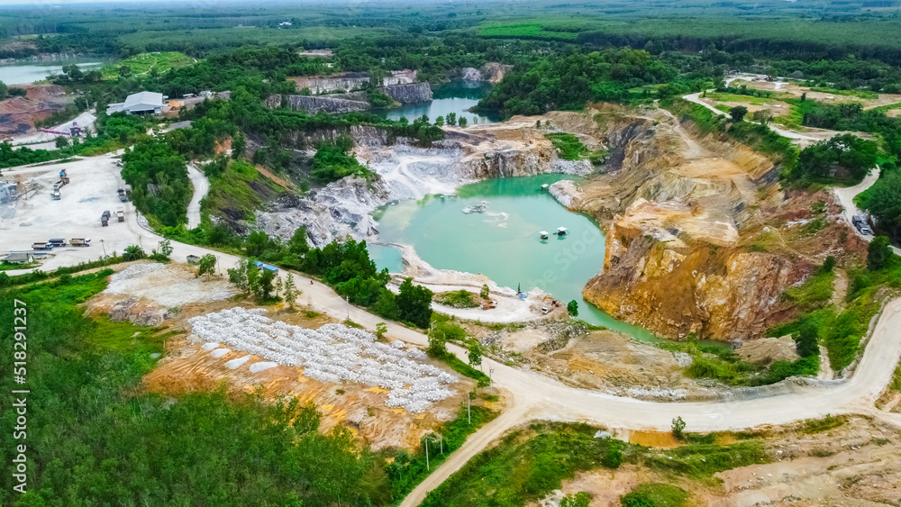 aerial photograph of a large pit of a gypsum mine. A large gypsum mine. Mining and Geology Industry Concepts