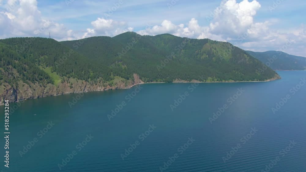 Flight over the rocky shore of lake. Wildlife. Green Forest. Drone video 4k footage. Landscape. Coastline. Flight over the rocky shore of lake. Wildlife. Green Forest. Drone video 4k footage. Landscape. Coastline.