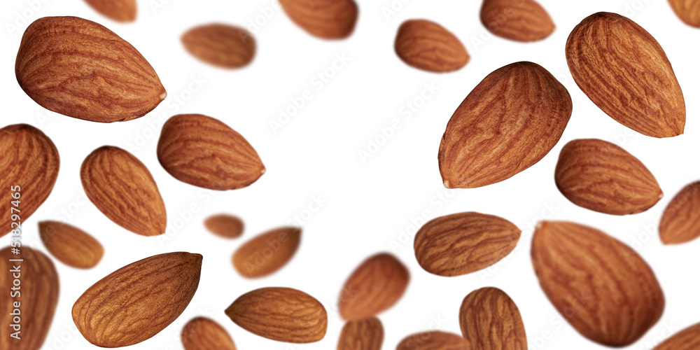 Almond background. Close-up almond nuts levitate on a white background. Space for text. Almond background. Close-up almond nuts levitate on a white background. Space for text.