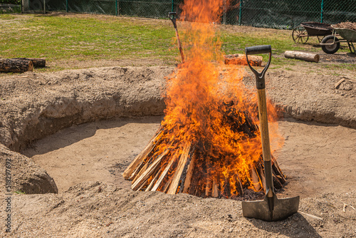 Preparation of the bonfire during the cooking process of the black clay of Gondar in Amarante, Portugal. photo