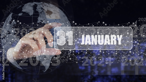 January 31st . Day 31 of month, Calendar date. Hand hold virtual screen card with calendar date. Winter month, day of the year concept.