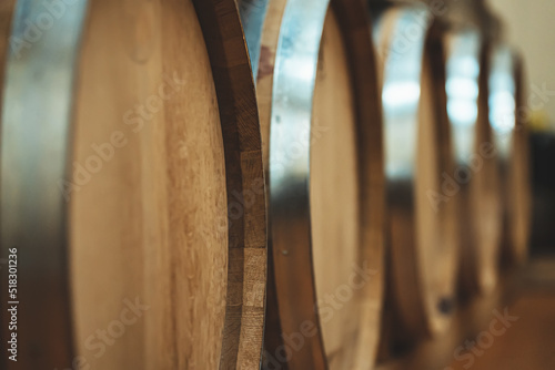 Bild auf Leinwand Wine barrels stacked in the cellar.