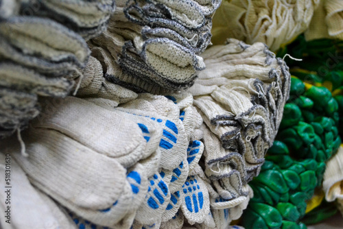 background with stack of work gloves in different colours