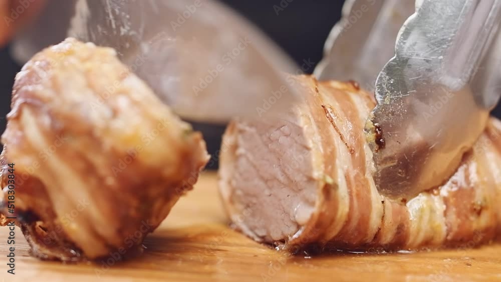 Cutting of bacon wrapped pork tenderloin.
Cutting of bacon wrapped pork tenderloin.