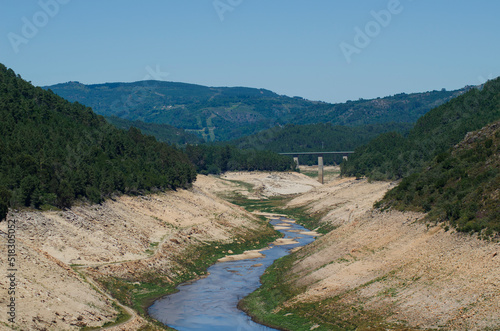 riverbed with little water due to drought caused by climate change, Spain, Ecology concept