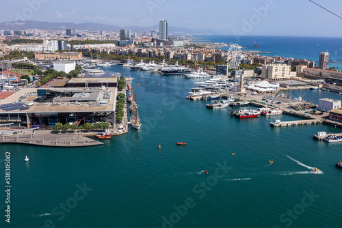 Barcelona, Catalonia Spain - 24.09.2021: Aerial view of the city from the overhead cable car, which crosses Port Vell, Barcelona's old harbour.