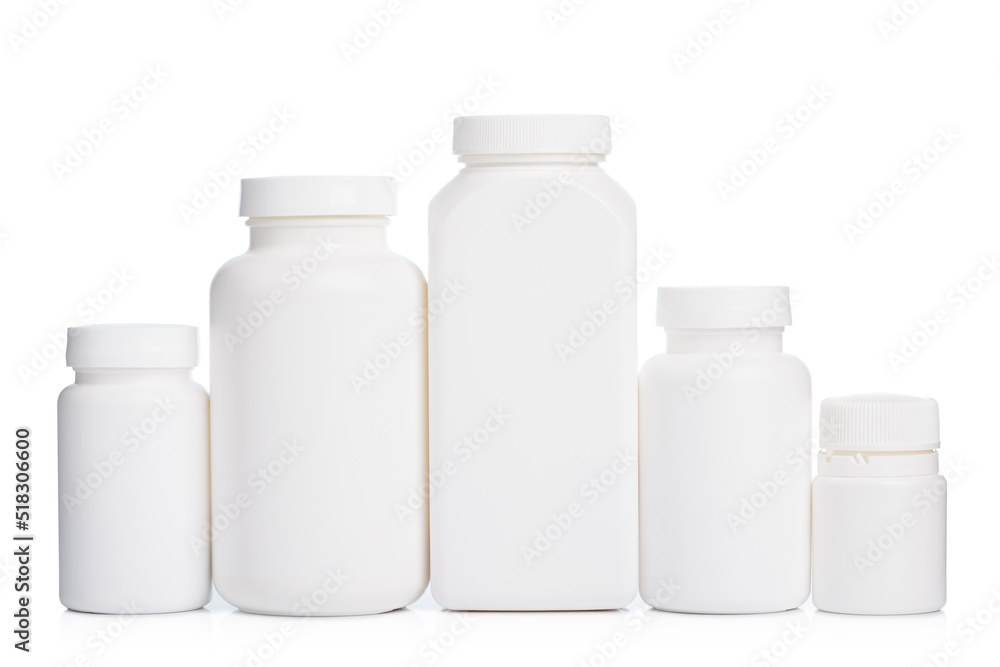 Blank plastic bottles with supplements or medicine in a row isolated on white background Blank plastic bottles with supplements or medicine in a row isolated on white background