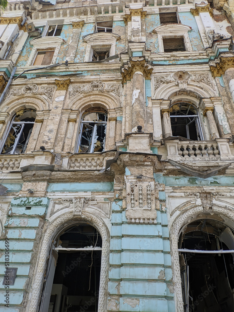 A destroyed historical building in the city center, as a result of rocket fire by Russian invaders. War in Ukraine.