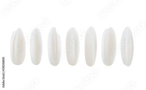 Set of grains of white rice on a white background.