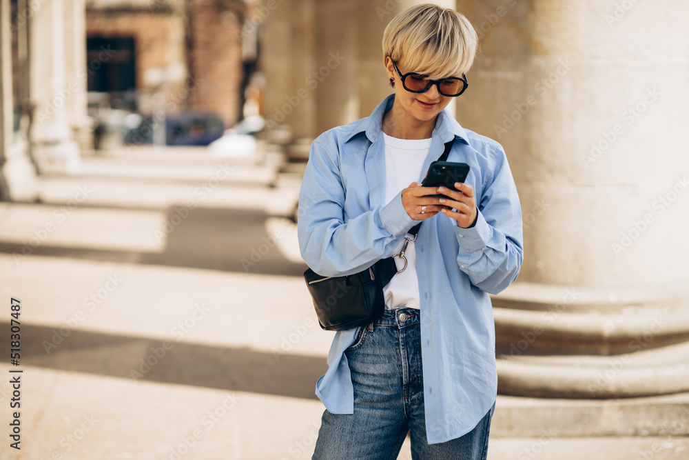 Portrait of woman using phone in the street Portrait of woman using phone in the street