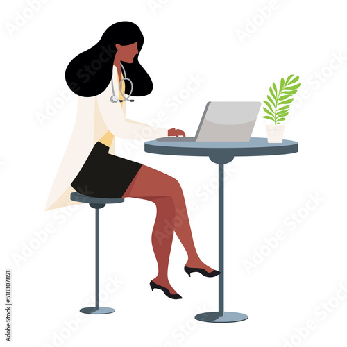 female doctor in her office using a computer