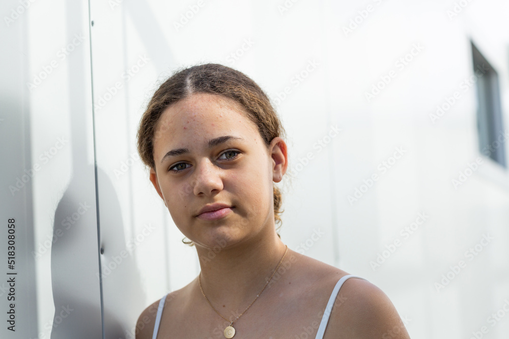 teen girl head and shoulders looking at camera Stock Photo | Adobe Stock