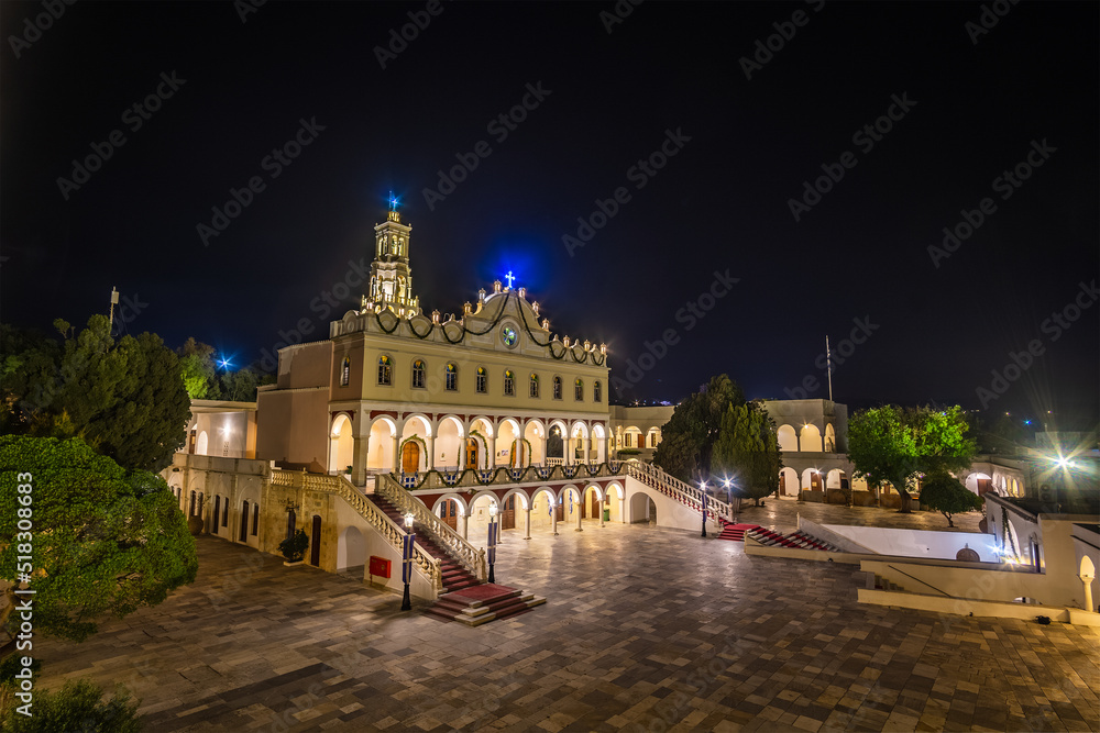 Obraz premium Exterior view of Panagia Megalochari church or Virgin Mary in Tinos island illuminated at night. It is the patron saint of Tinos and considered as the saint protector of Greece