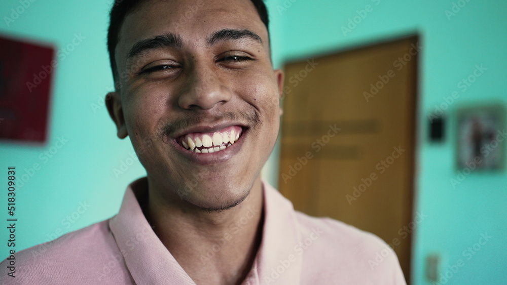 One happy hispanic man laughing and smiling at camera One happy hispanic man laughing and smiling at camera