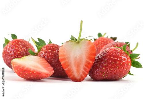 Close up group of fresh organic red strawberries cut in half, ready for eating on white background