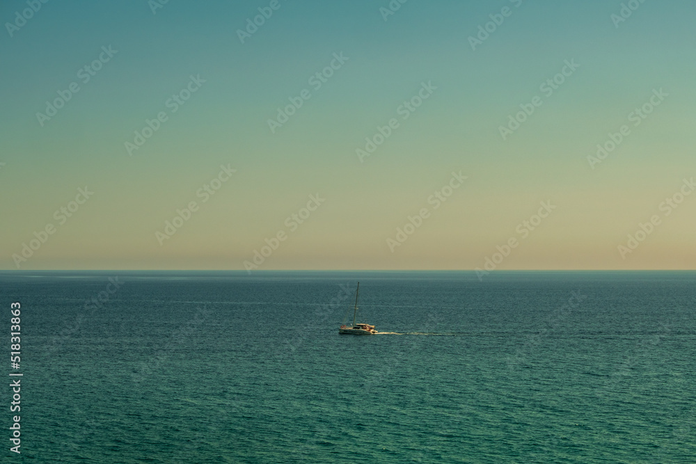 Beautiful view from a sailboat of Nerja beach in the Mediterranean sea Beautiful view from a sailboat of Nerja beach in the Mediterranean sea