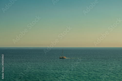 Beautiful view from a sailboat of Nerja beach in the Mediterranean sea