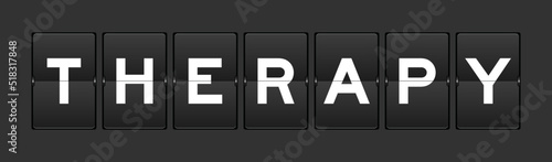 Black color analog flip board with word therapy on gray background