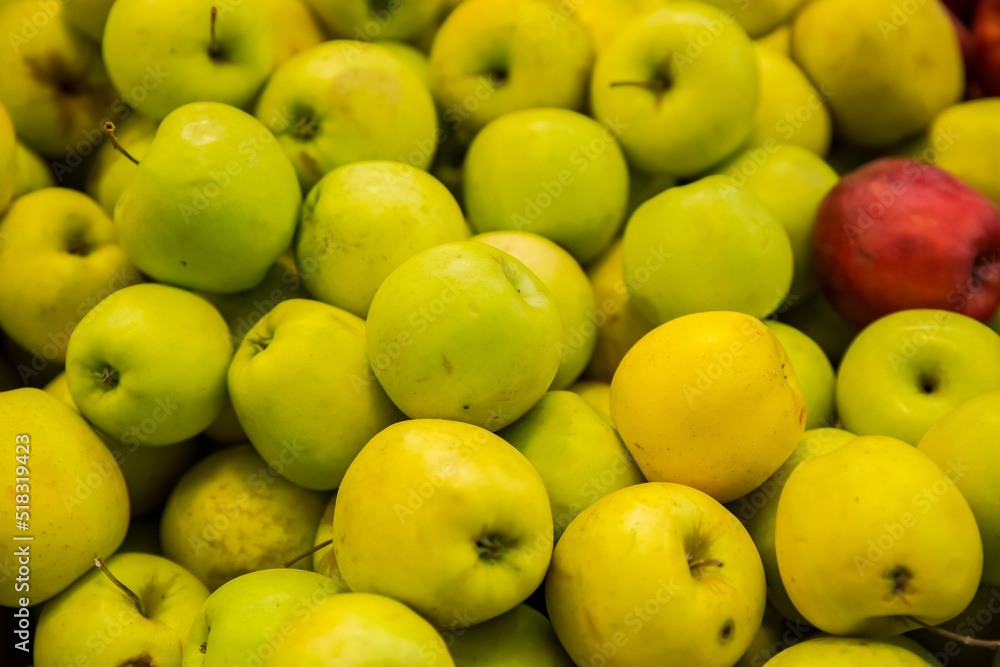Seasonal fruits at the agricultural market, apples
