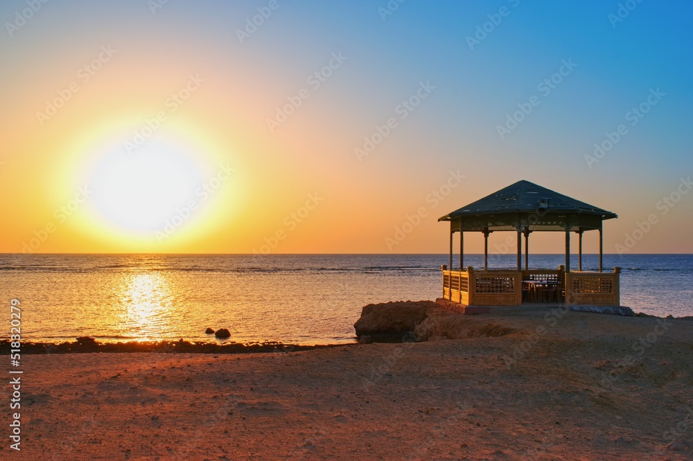Idylic beach with gazebo within sunrise,  Marsa Alam , Red Sea, Egypt
