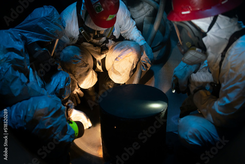 Workers, inspection process, chemical tanks, safety, confined spaces photo
