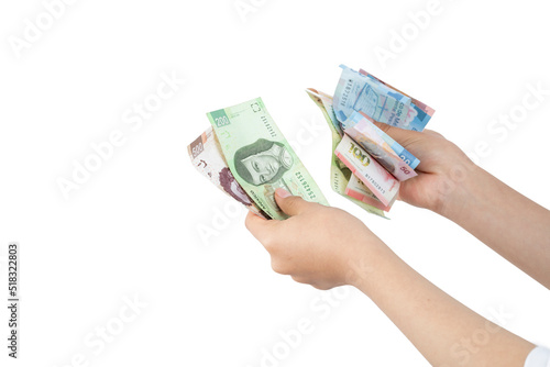 Woman's hands count bills of Mexican pesos, with white background