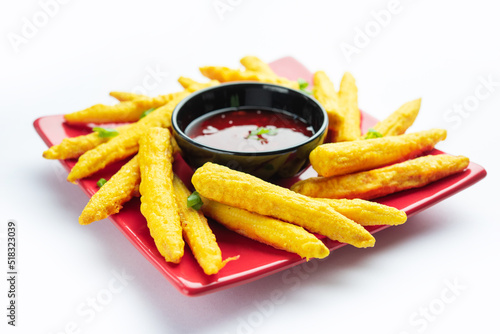 Crispy fried baby corn pakoda, pakora  or Baby corn fritters served with ketchup, Indian food photo