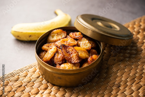 Deep fried ripe plantain slices or pake kele fried chips in a bowl