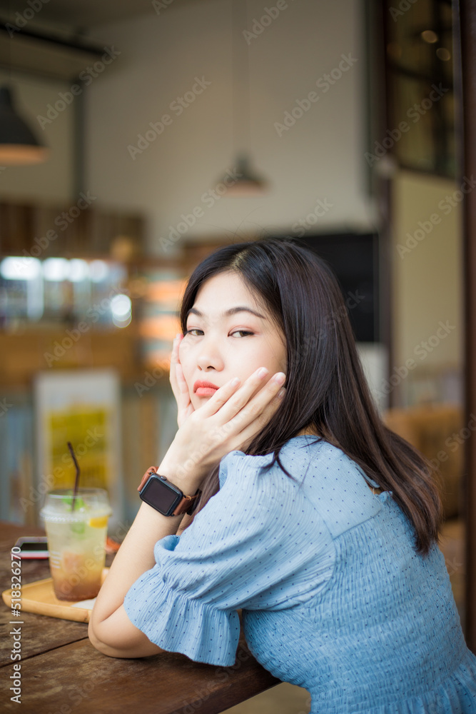 Beautiful asian women sitting in coffee shop Beautiful asian women sitting in coffee shop