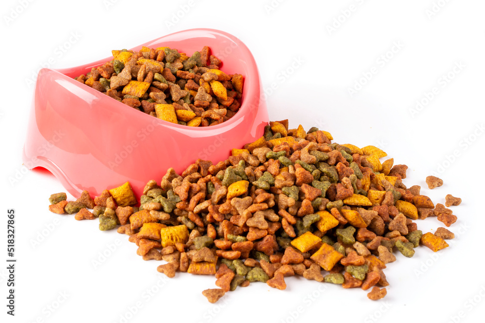 Pink bowl with dry cat food close-up on a white isolated background. Balanced nutrition of pets. Template for the design. Pink bowl with dry cat food close-up on a white isolated background. Balanced nutrition of pets. Template for the design.