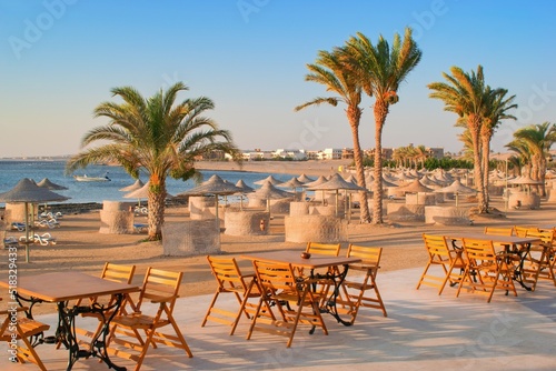 Idylic beach with palms and sun umbrelas  Red Sea  Egypt