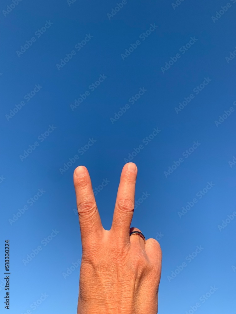 peace sign is shown to the sky with lots of copy space peace sign is shown to the sky with lots of copy space
