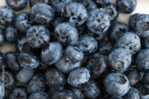 Water drops on ripe sweet blueberry. Fresh blueberries background with copy space for your text.